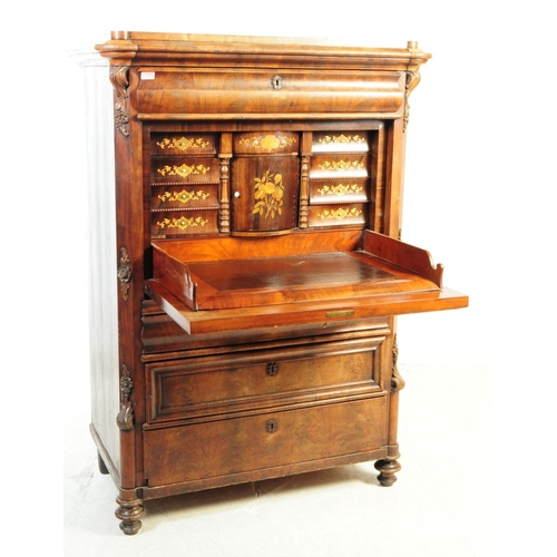 1124 - A 19th century Biedermeier walnut secretaire abittant desk. The secretaire raised on turned bun feet... 