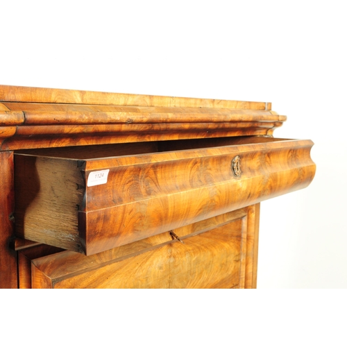 1124 - A 19th century Biedermeier walnut secretaire abittant desk. The secretaire raised on turned bun feet... 