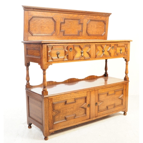 1127 - An early 20th century 1930s Oak wood Jacobean revival buffet sideboard. The buffet having two cupboa... 