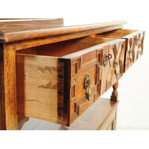 1127 - An early 20th century 1930s Oak wood Jacobean revival buffet sideboard. The buffet having two cupboa... 