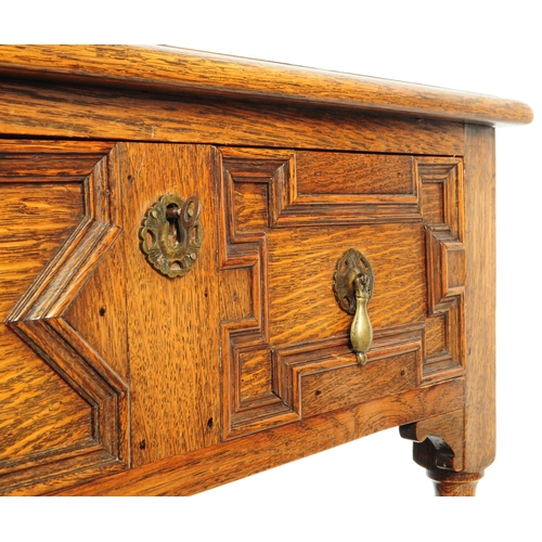 1127 - An early 20th century 1930s Oak wood Jacobean revival buffet sideboard. The buffet having two cupboa... 