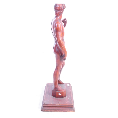 1130 - A large 20th Century carved wood David by Michelangelo sculpture / figure upon stepped square base. ... 