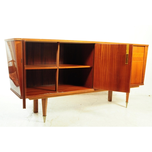 557 - A large mid century sideboard credenza in square form with tapering sides. Of solid wood constructio... 