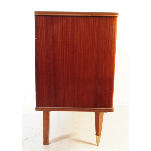 557 - A large mid century sideboard credenza in square form with tapering sides. Of solid wood constructio... 