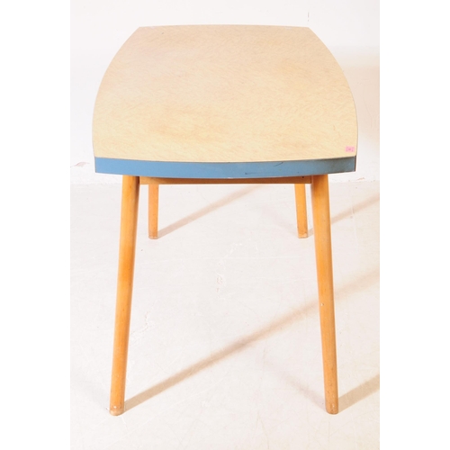 560 - British Modern Design - A mid 20th century formica topped kitchen dining table. The table raised on ... 