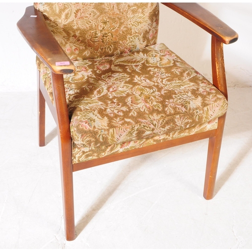 565 - Parker Knoll - A mid 20th century Parker Knoll PK 928/9 lounge armchair. The chair having shaped woo... 