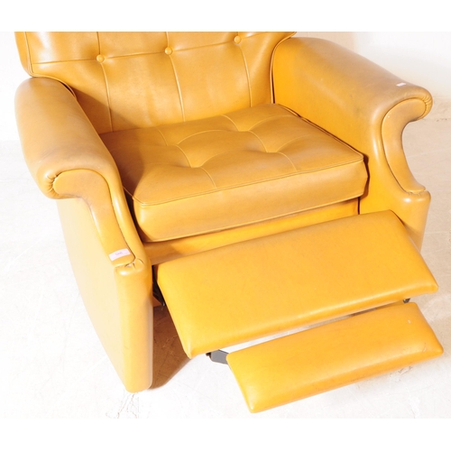 566 - Parker Knoll - A mid 20th century Parker Knoll model N30 tan leather reclining armchair. The armchai... 