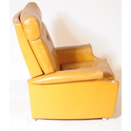 566 - Parker Knoll - A mid 20th century Parker Knoll model N30 tan leather reclining armchair. The armchai... 