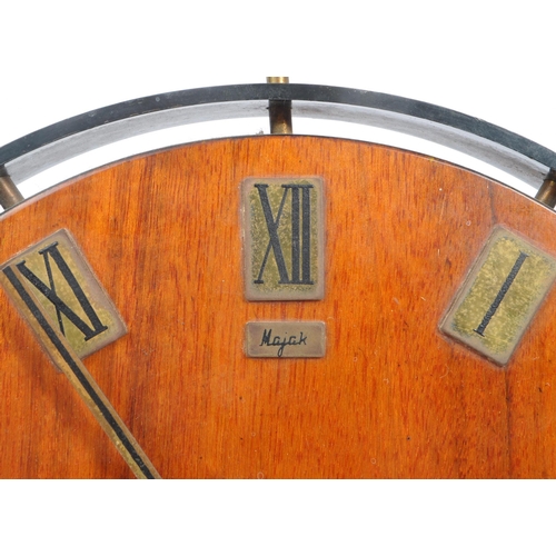 567 - Majak - A mid Century wooden Majak wall clock having brass plaque squares around the edge with black... 