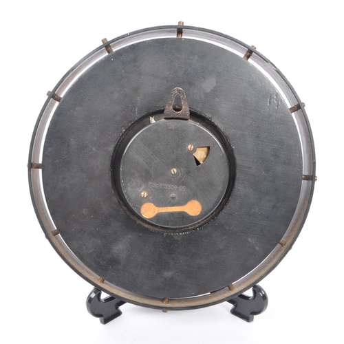 567 - Majak - A mid Century wooden Majak wall clock having brass plaque squares around the edge with black... 