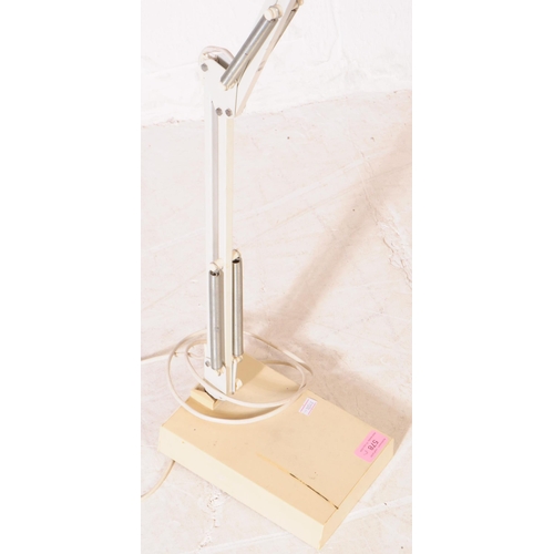 578 - A Anglepoise influenced mid century spring loaded desk top lamp, Dual arm construction finished with... 