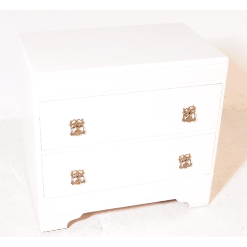 580 - A pair of mid 20th century 1940s painted chest of drawers. The chests each raised on bracket feet to... 