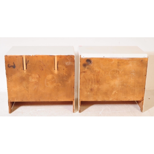 580 - A pair of mid 20th century 1940s painted chest of drawers. The chests each raised on bracket feet to... 