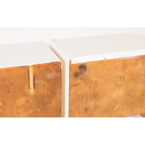 580 - A pair of mid 20th century 1940s painted chest of drawers. The chests each raised on bracket feet to... 