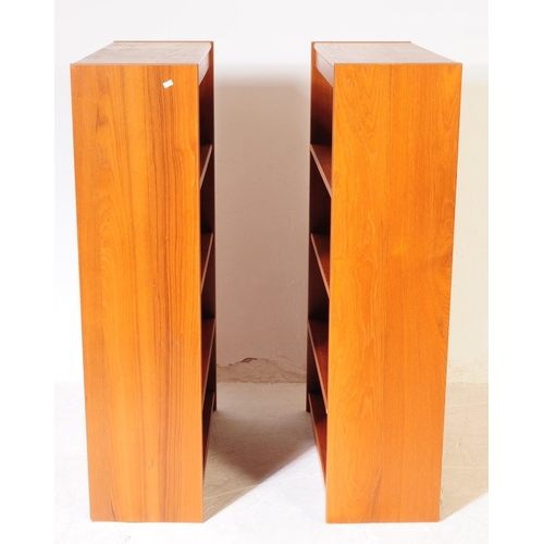 581 - British Modern Design - A pair of mid 20th century teak veneer open faced bookcases. The bookcases e... 