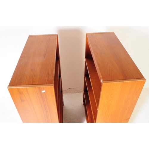 581 - British Modern Design - A pair of mid 20th century teak veneer open faced bookcases. The bookcases e... 