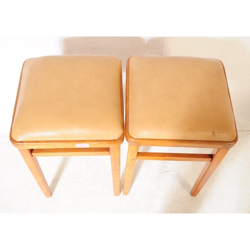 582 - British Modern Design - Two pairs of vintage 20th century bar / kitchen stools. Having leatherette c... 