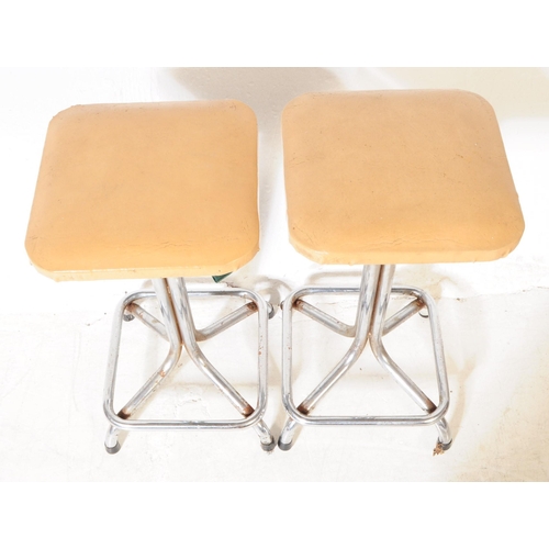 582 - British Modern Design - Two pairs of vintage 20th century bar / kitchen stools. Having leatherette c... 