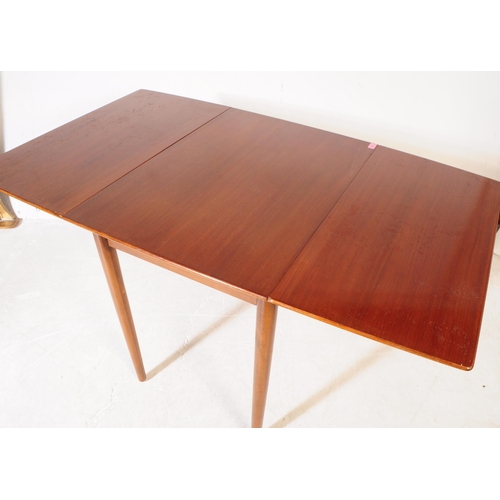 584 - British Modern Design - A mid 20th century teak wood drop leaf dining table and chairs. The dining t... 