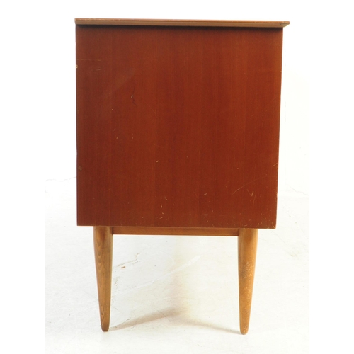 589 - British Modern Design - A mid 20th century teak veneer sideboard credenza. The sideboard raised on t... 