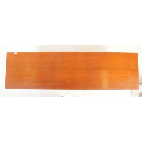 589 - British Modern Design - A mid 20th century teak veneer sideboard credenza. The sideboard raised on t... 