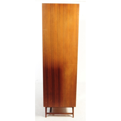 590 - Meredew Furniture - A mid 20th century Meredew Furniture teak veneer double wardrobe. The wardrobe r... 