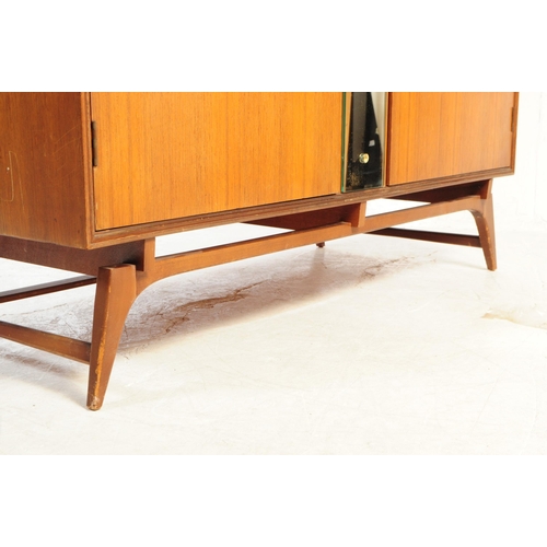 590 - Meredew Furniture - A mid 20th century Meredew Furniture teak veneer double wardrobe. The wardrobe r... 