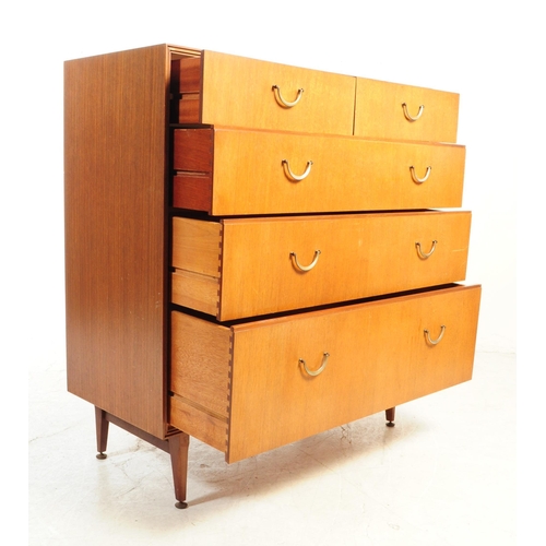 591 - British Modern Design - A mid 20th century teak veneer chest of drawers. The chest of drawers raised... 