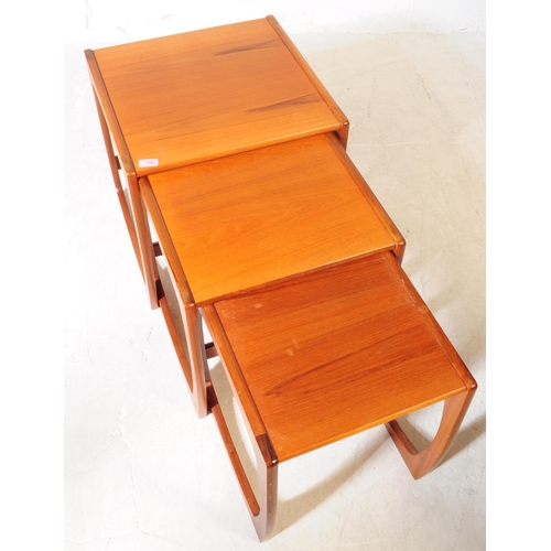 593 - British Modern Design - A mid 20th century teak wood nest of tables. The nest of side tables, raised... 