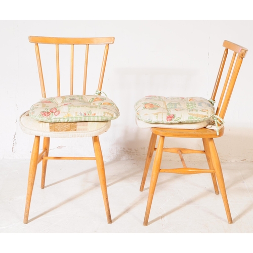 594 - Ercol - Model 391 - A pair of mid 20th century Ercol model 391 beech & elm wood dining chairs. The c... 