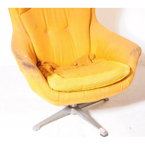 596 - British Modern Design - A mid 20th century circa 1960s swivel egg lounge armchair. The chair raised ... 