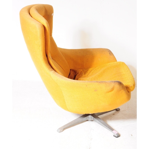 596 - British Modern Design - A mid 20th century circa 1960s swivel egg lounge armchair. The chair raised ... 