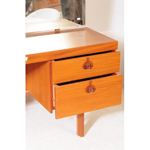 597 - British Modern Design - A mid 20th century teak veneer dressing table and stool. The dresser having ... 