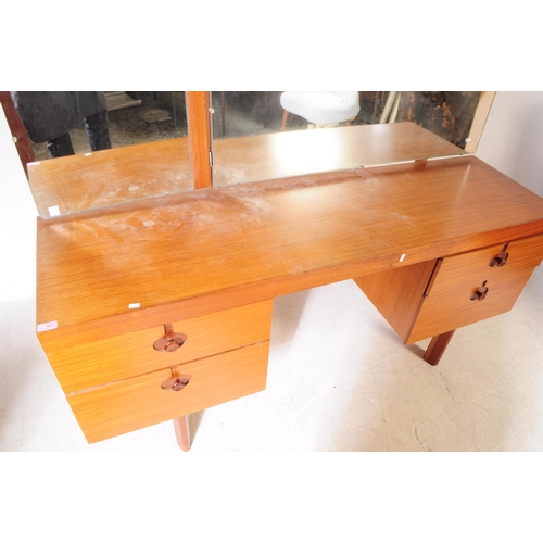 597 - British Modern Design - A mid 20th century teak veneer dressing table and stool. The dresser having ... 