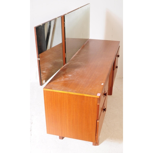 597 - British Modern Design - A mid 20th century teak veneer dressing table and stool. The dresser having ... 