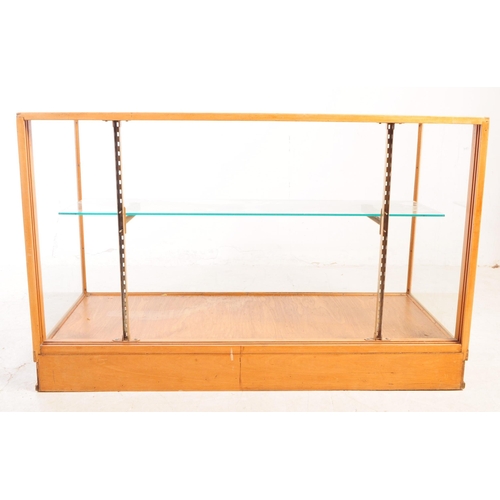 598 - A vintage 20th century haberdashery shop display cabinet. Rectangular form with glass top and sides,... 