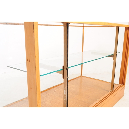 598 - A vintage 20th century haberdashery shop display cabinet. Rectangular form with glass top and sides,... 