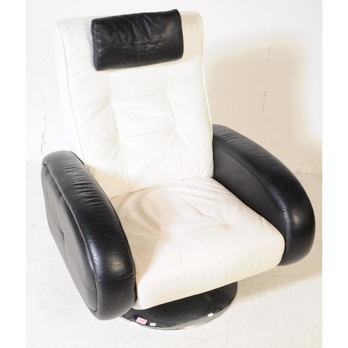 609 - A mid 20th century leather swivel armchair. The chair raised on a circular metal base, having rounde... 