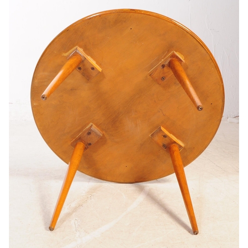 615 - British Modern Design - A mid Century small teak circular coffee table raised upon rounded tapered l... 