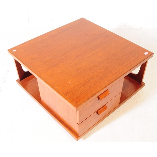 616 - British Modern Design - A mid Century retro teak two tier coffee / side table of square form having ... 