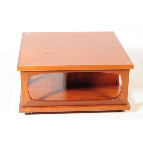 616 - British Modern Design - A mid Century retro teak two tier coffee / side table of square form having ... 