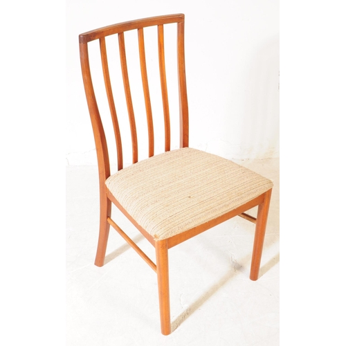 621 - Mcintosh - A set of four retro mid century teak dining chairs. Having slatted backrest on white upho... 