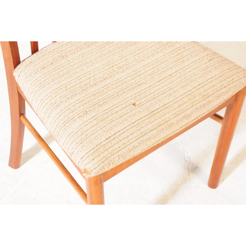 621 - Mcintosh - A set of four retro mid century teak dining chairs. Having slatted backrest on white upho... 