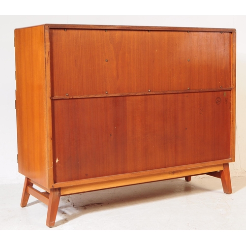 627 - Beautility Furniture - A mid century circa 1950s oak veneered sideboard credenza. Bow front top sect... 