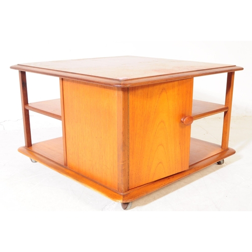 628 - Nathan Squares - A retro mid 20th century teak coffee table. Square form with configuration of pigeo... 