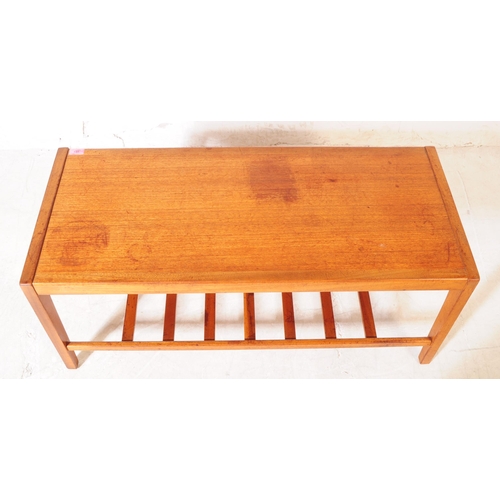 631 - British Modern Design - A mid century teak coffee / occasional table. Rectangular form with square u... 