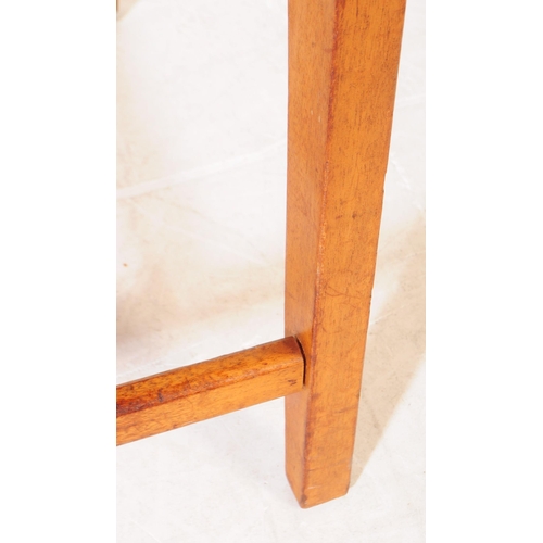 631 - British Modern Design - A mid century teak coffee / occasional table. Rectangular form with square u... 