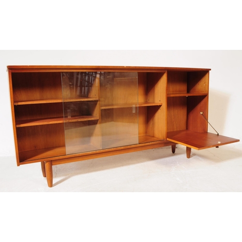 633 - British Modern Design - A vintage mid century teak bookcase cabinet. Rectangular form with twin slid... 