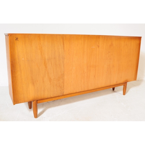 633 - British Modern Design - A vintage mid century teak bookcase cabinet. Rectangular form with twin slid... 