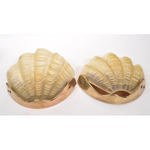 641 - A pair of early 20th century 1930s Art Deco clam shell wall lights shades. The lights having undulat... 